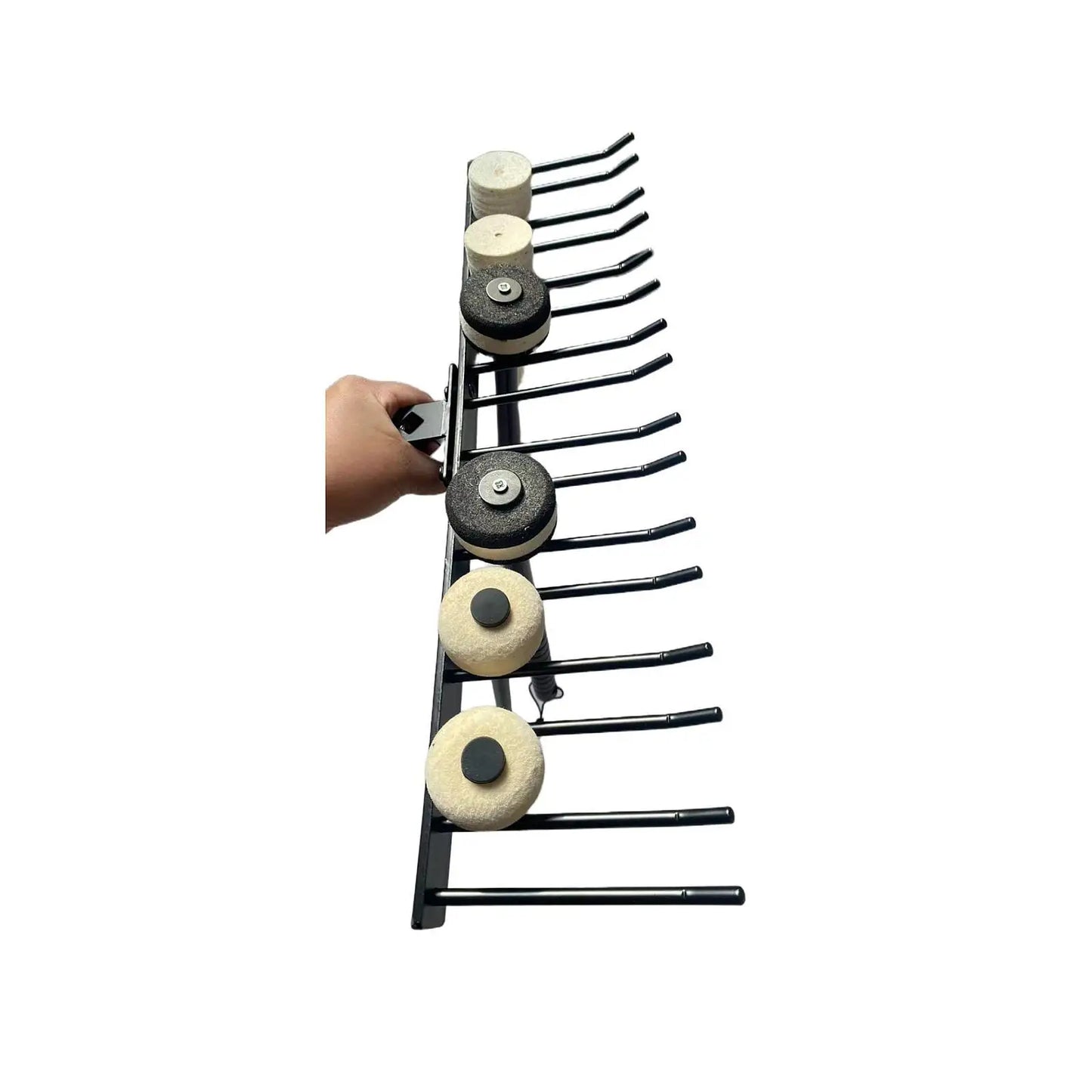 Black metal drumsticks display stand holding multiple circular abrasive pads with black and white centers for mallets wall mount