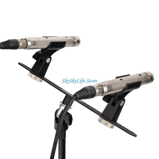Two silver condenser microphones with black foam windshields on a black aluminum adjustable stand for studio field recording