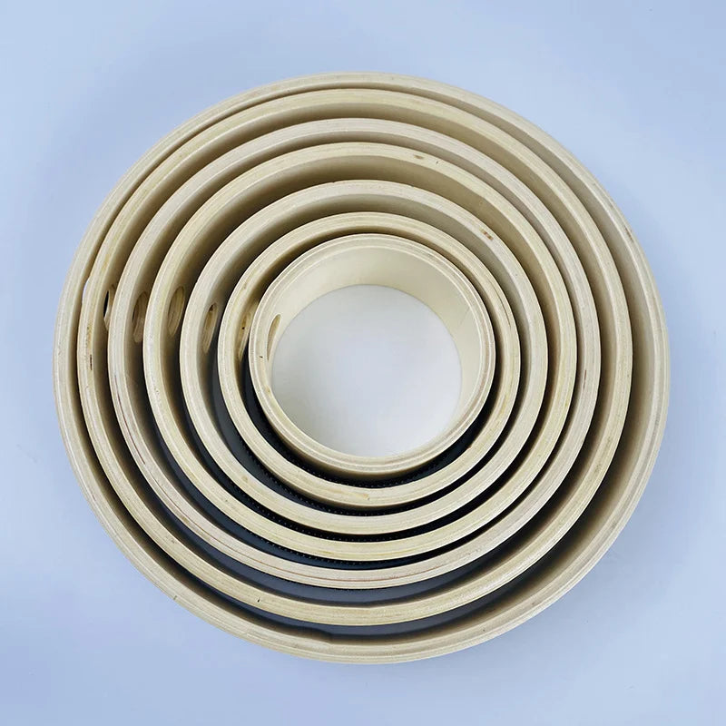 Beige and black rubber gaskets arranged in concentric layers for educational wooden hand beat percussion harp drum music toy
