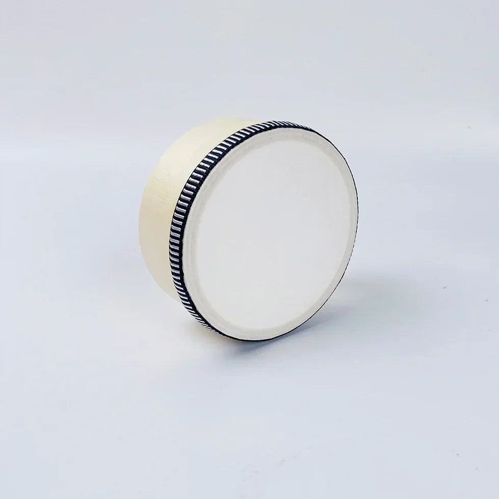 Cream-colored educational wooden hand beat percussion harp drum with black and white striped ribbon rim for children
