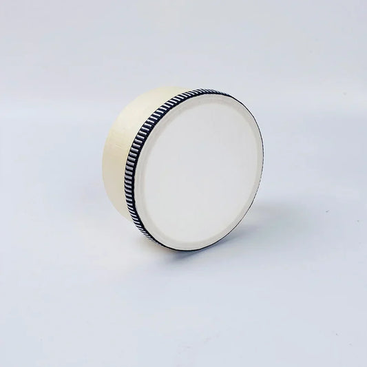 Cream-colored educational wooden hand beat percussion harp drum with black and white striped ribbon rim for children