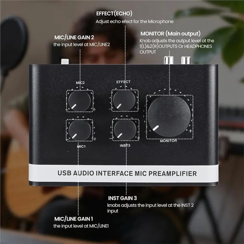 Black usb audio interface mic preamplifier with silver knobs and white label for recording live streaming phantom power