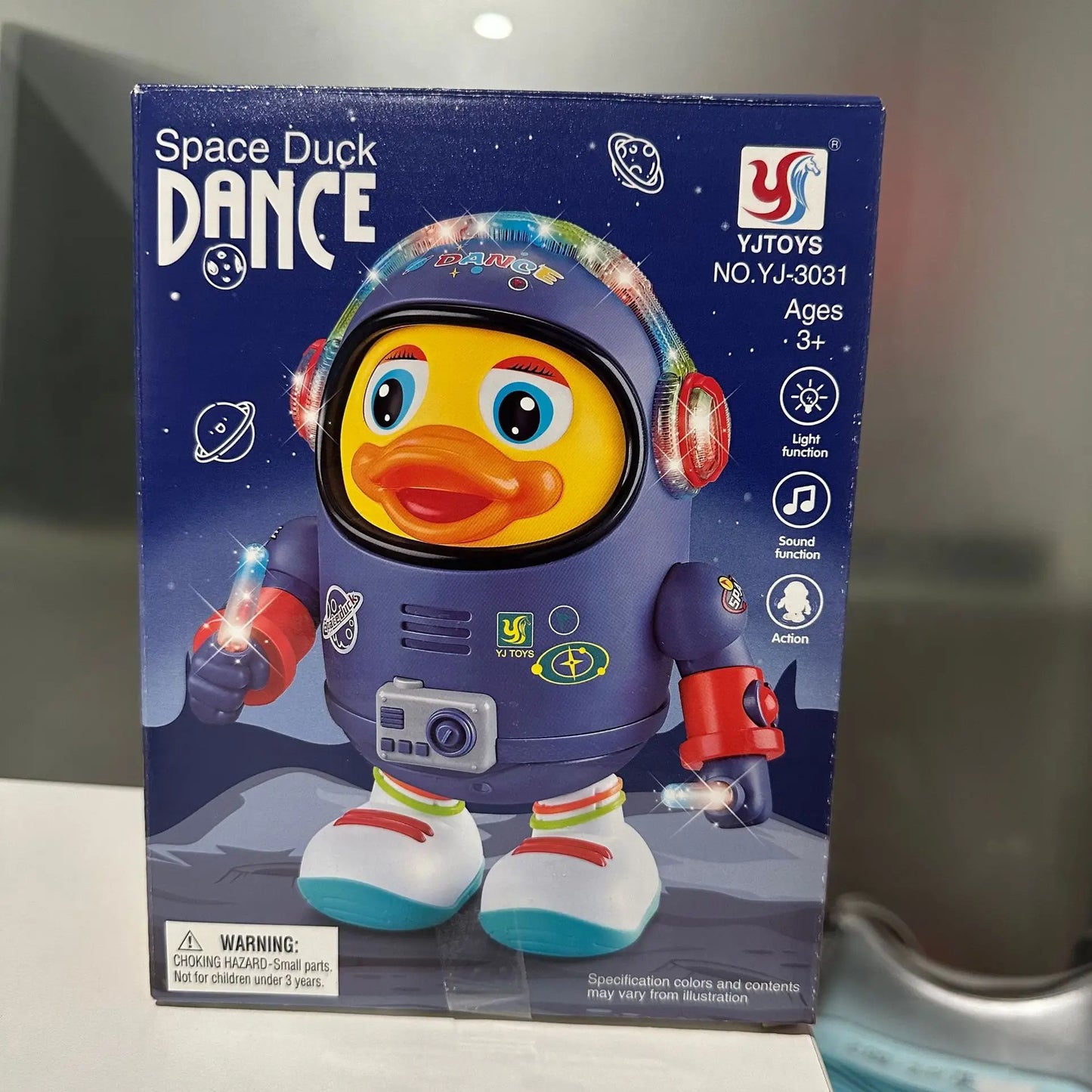 A yellow dancing space duck toy in a purple astronaut suit with glowing lights and red and white boots for children