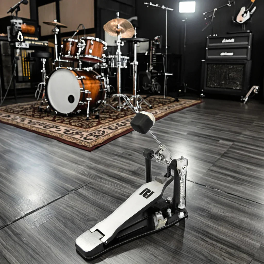 Black and silver pedal with white footplate featuring p logo for electric drum set with mesh head for students and beginners