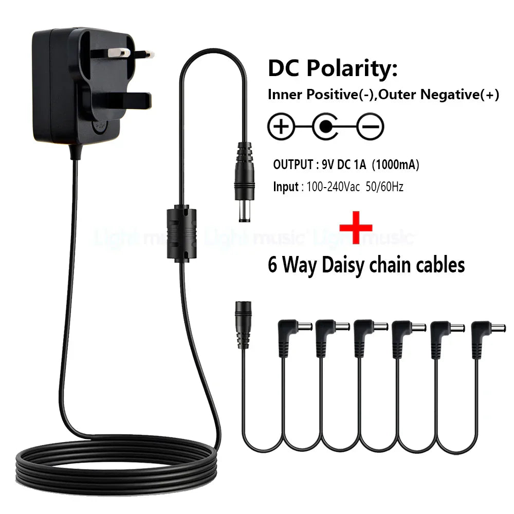 Black plastic electric guitar pedal power adapter with 9v dc output six daisy chain cables and true bypass design