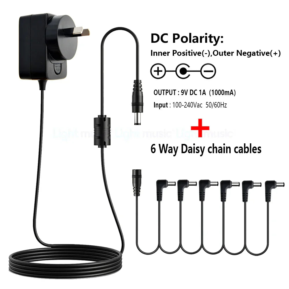 Black plastic power adapter with 9v dc output and six daisy chain cables for electric guitar pedals with true bypass design
