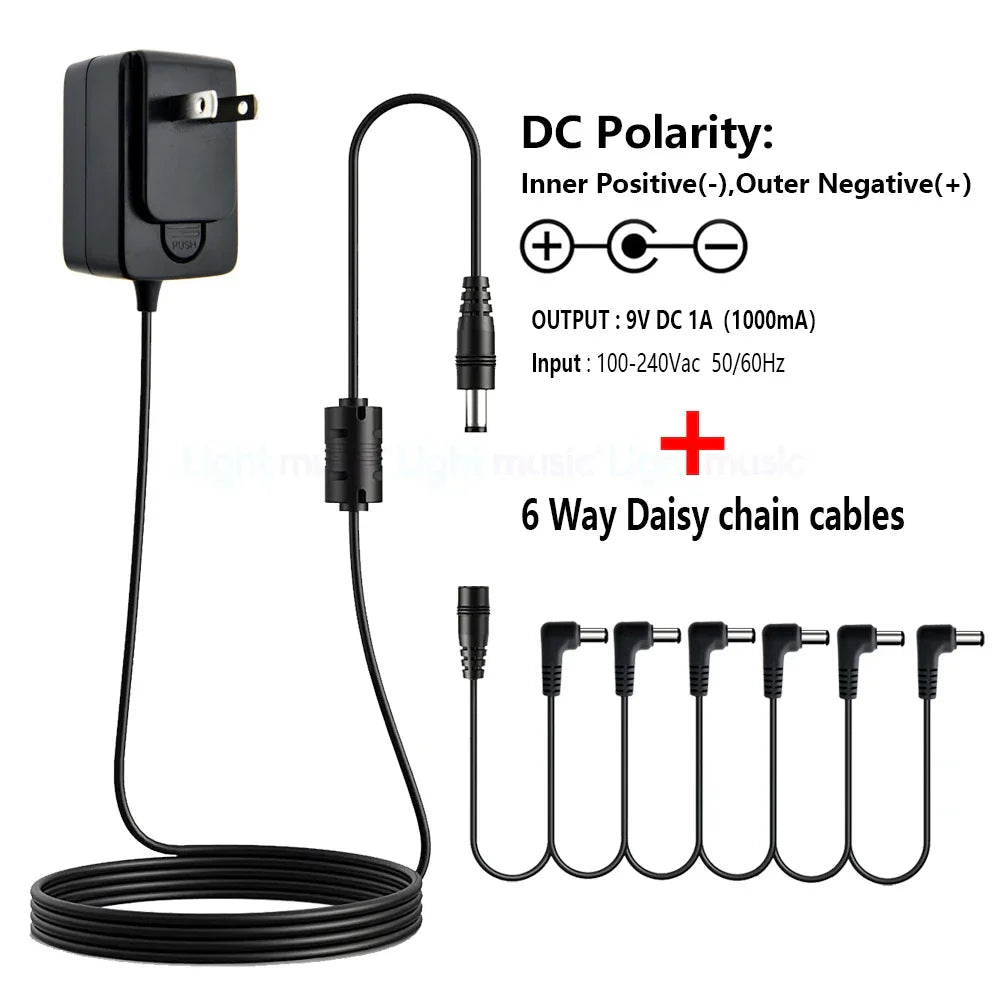 Black plastic electric guitar pedal power adapter with 9v dc output six daisy chain cables true bypass design