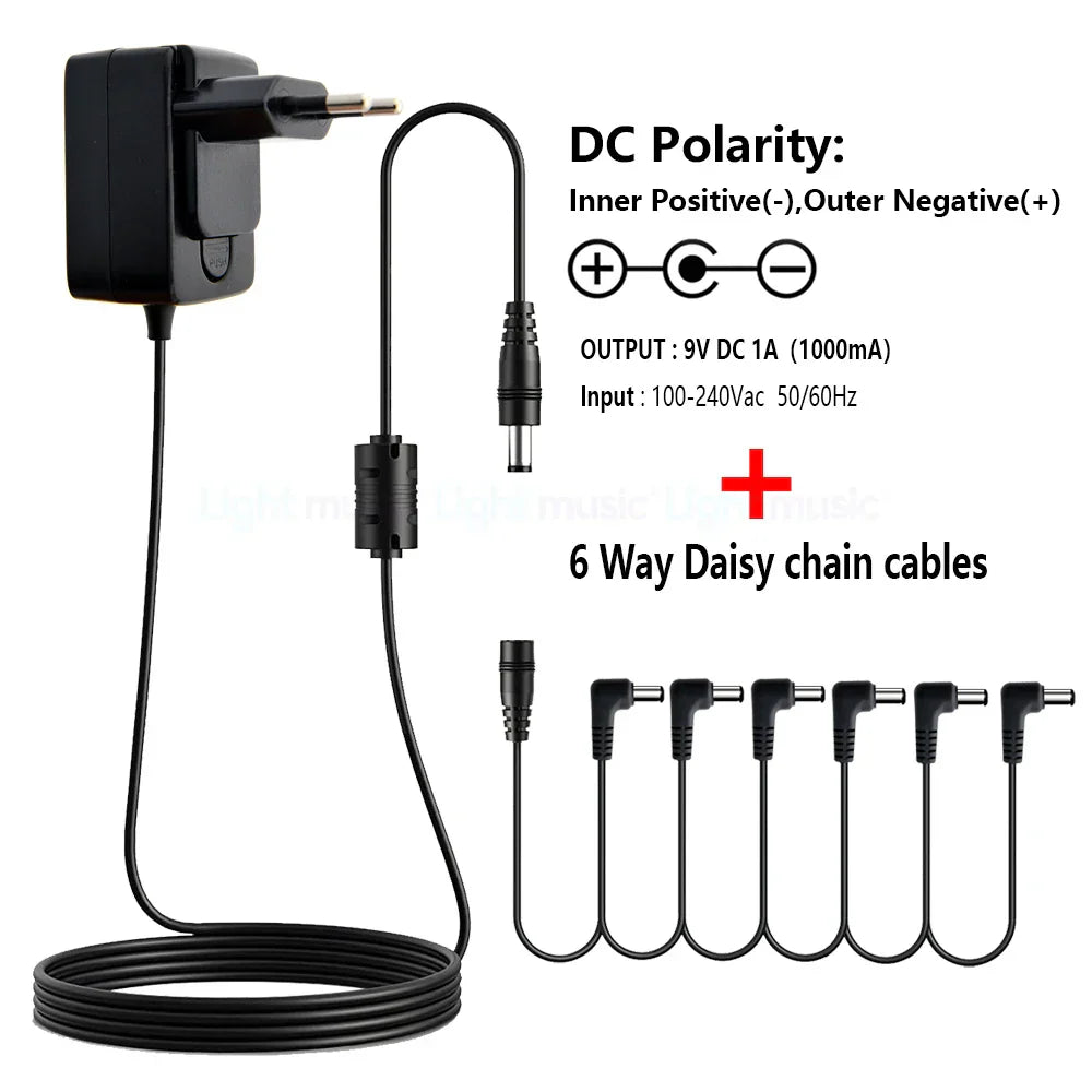 Black plastic electric guitar pedal power adapter with 9v dc output and six daisy chain cables for true bypass design