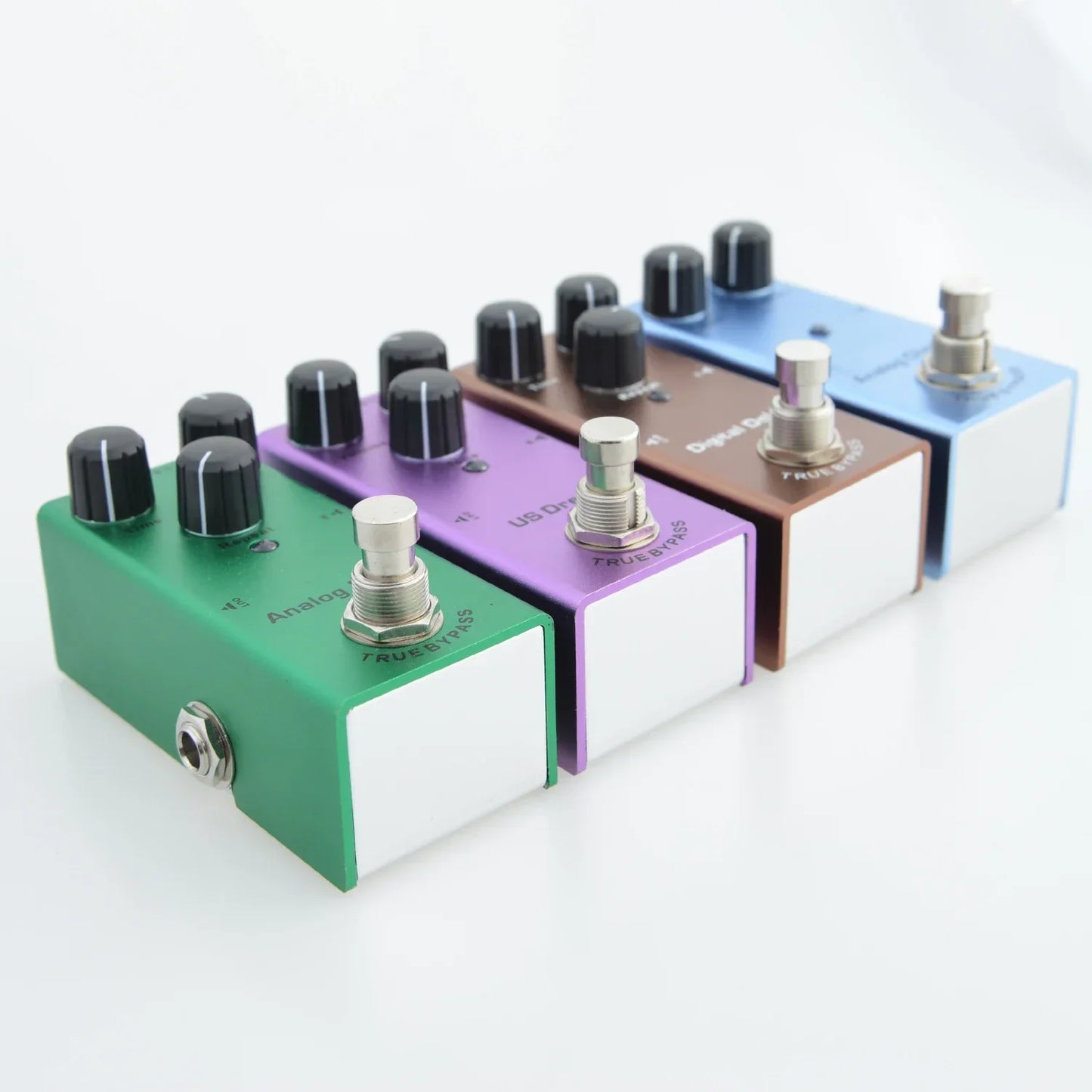 A set of four colorful electric guitar pedals with aluminum alloy casing, stoving varnish finish, and true bypass design