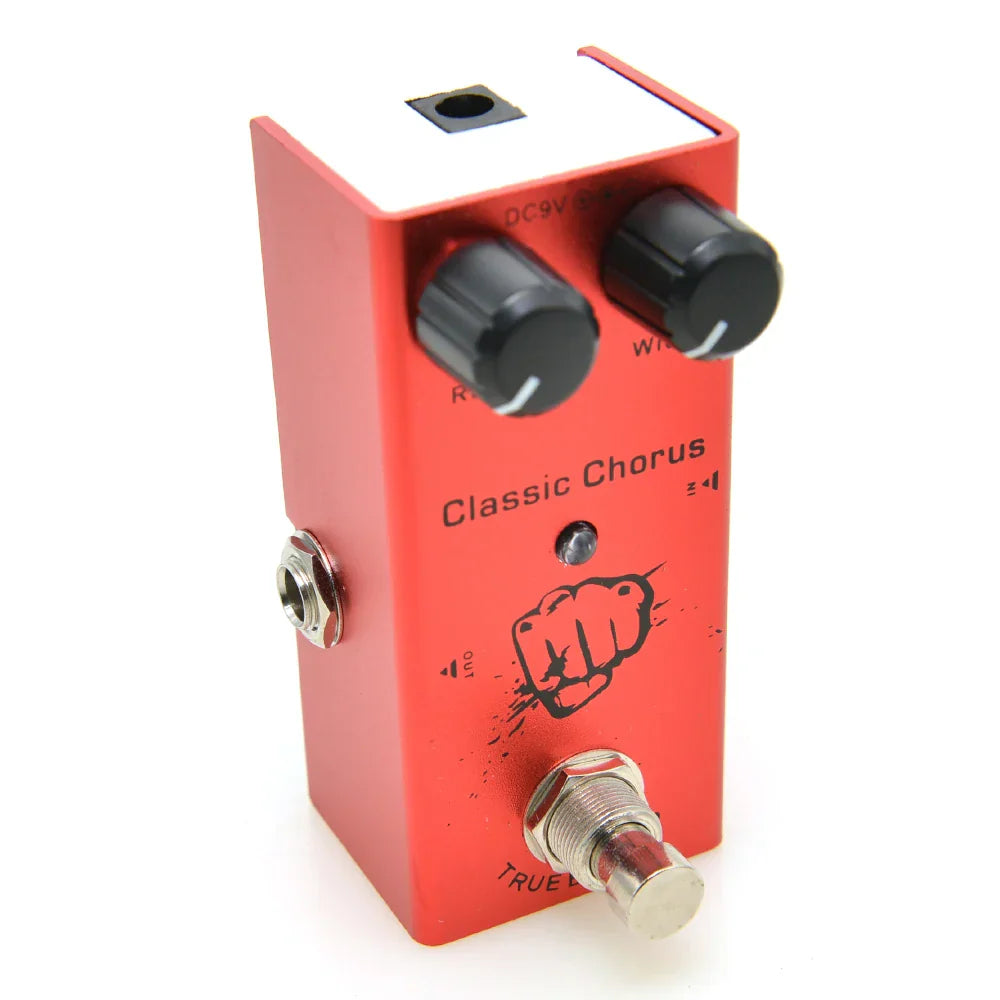 Red metal electric guitar pedal with aluminum alloy casing black knobs true bypass design and black fist graphic