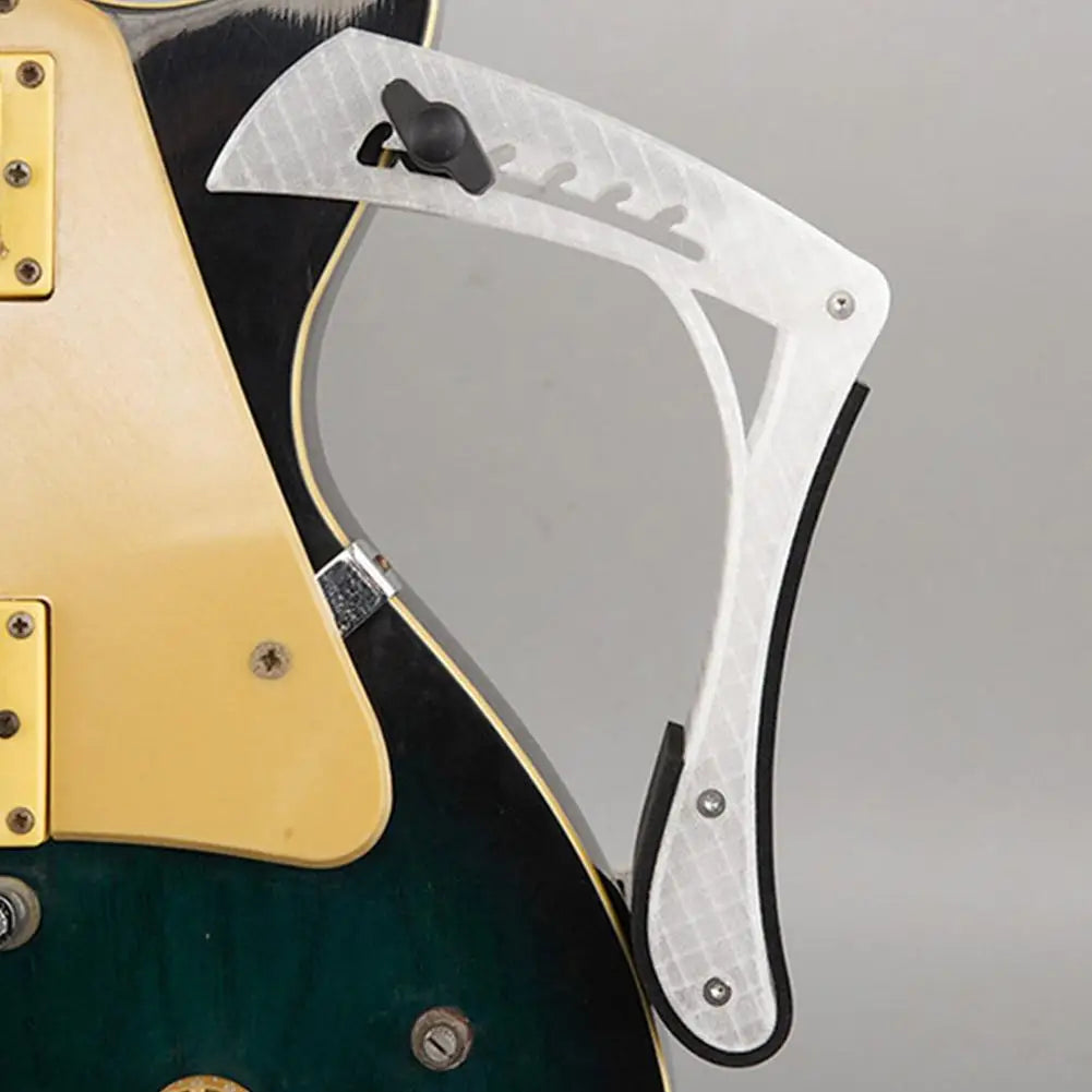 White plastic electric wood guitar leg rest with black rubber edges textured diamond pattern for labor-saving use
