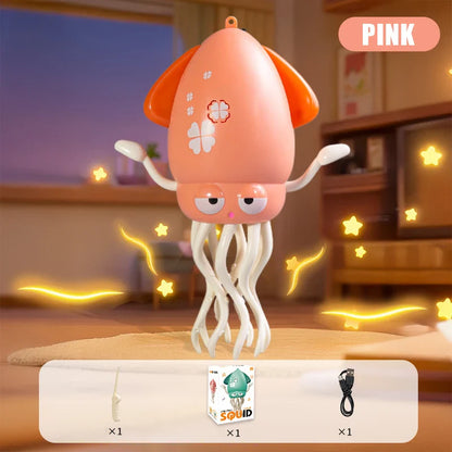 Pink plastic dancing squid toy with orange fins white tentacles floral decals lights music interactive gift