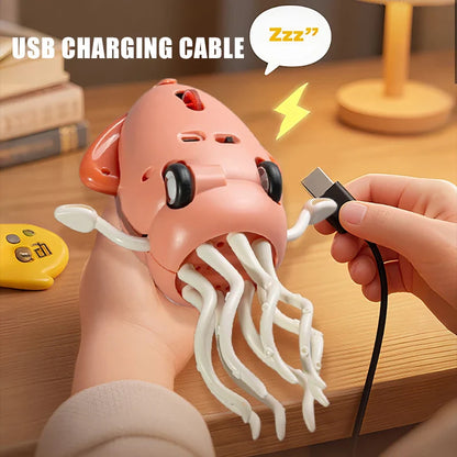 Pink plastic dancing squid usb charging cable with white tentacles and black eyes for interactive toddler toys