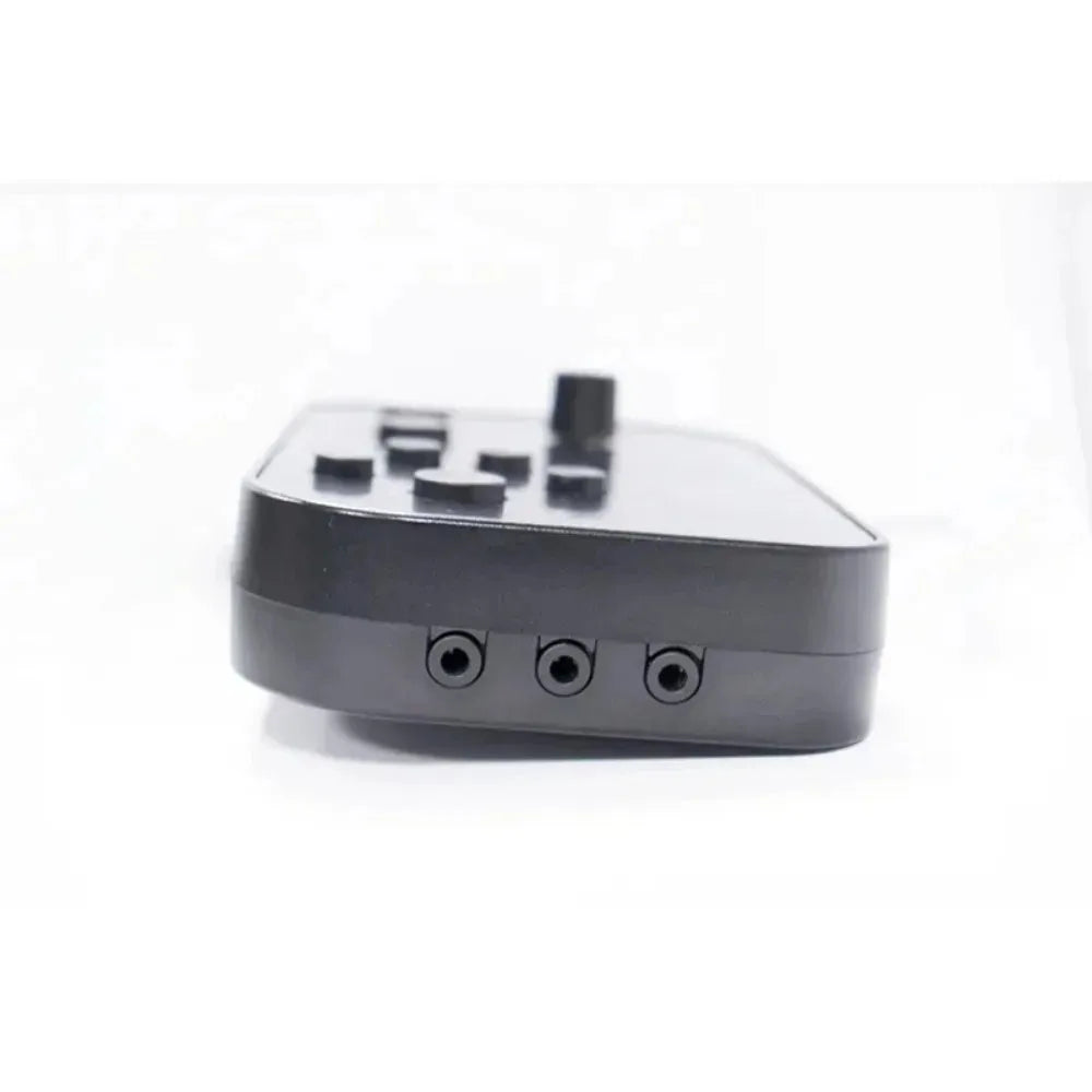 Black matte plastic gaming controller with multiple buttons and three circular ports for electronic drum kit mt10 usb midi headphone use