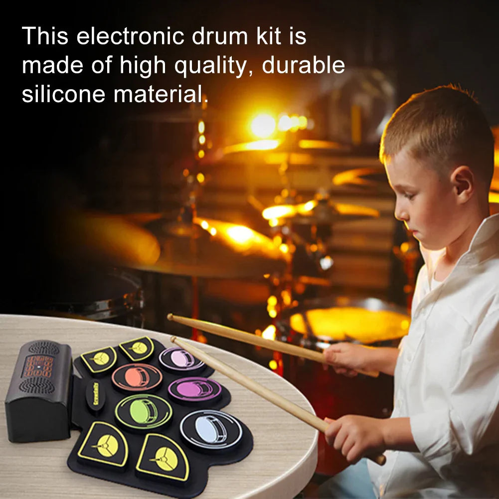 Black silicone electronic drum set with colorful circular pads and compact speaker unit for roll-up drum practice
