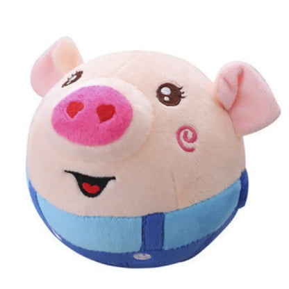 A soft pink plush pig toy wearing blue overalls designed as an electronic pet dog interactive moving toy