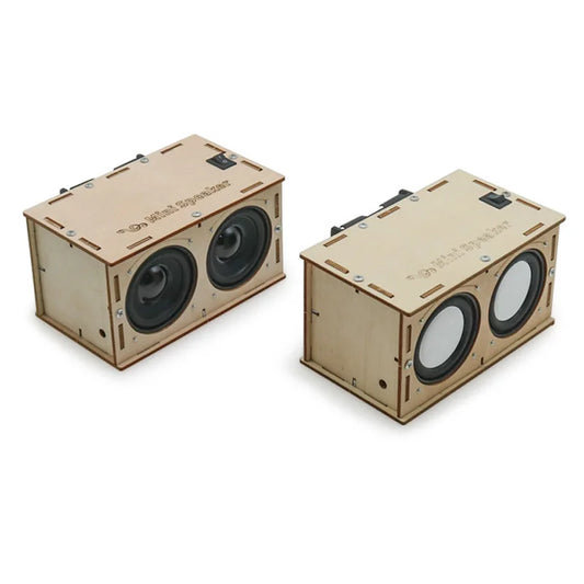 Two beige wooden diy bluetooth speaker mini boxes with black drivers for electronic sound amplifier school projects experiment kits