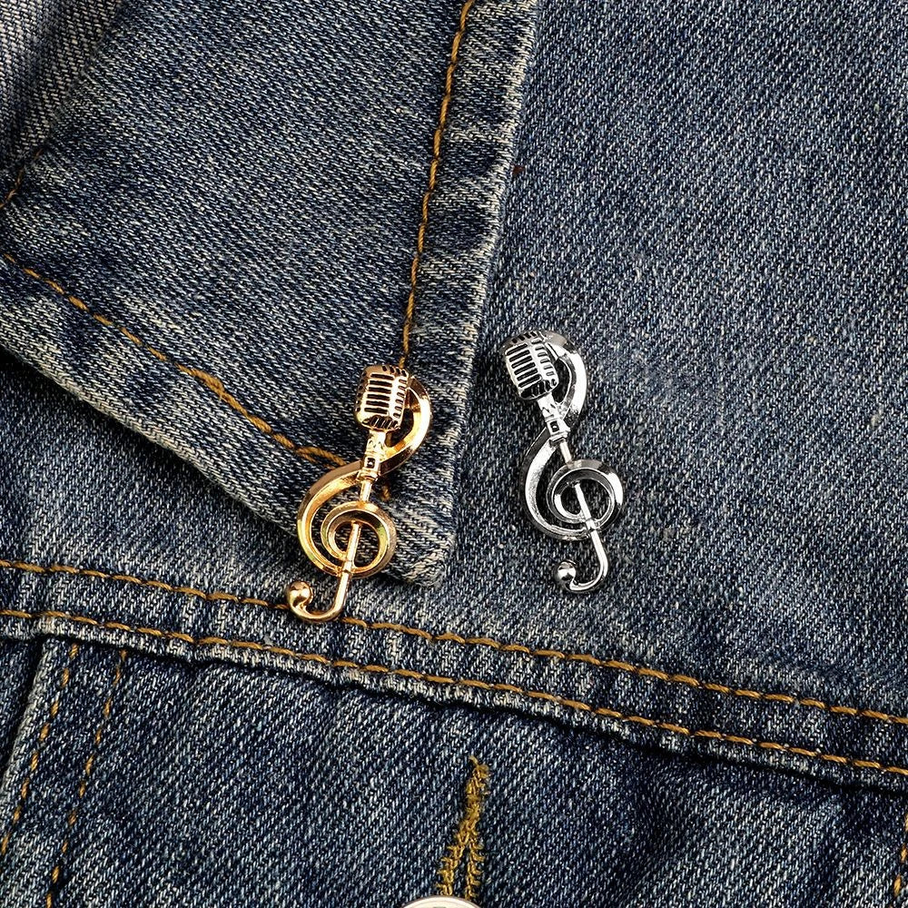 Two metallic microphone-shaped music note brooch pins in gold and silver ideal as band souvenir jewelry accessories gifts