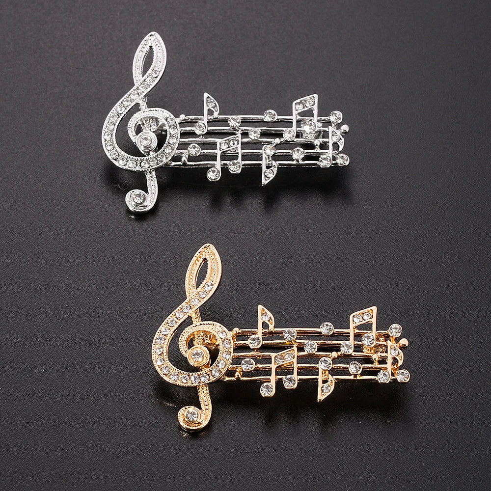 Two sparkling silver and gold music note brooches with clear rhinestones band souvenir jewelry accessories gifts