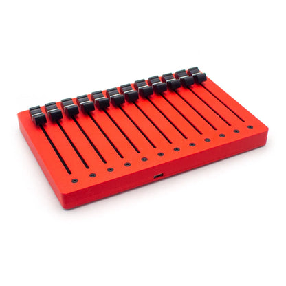 Red rectangular em-12f motor fader midi controller with black keys and faders usb plug port on the side
