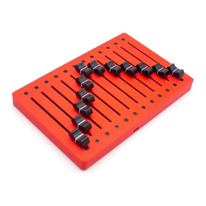 Red rectangular metal panel of em-12f motor fader midi controller with black toggle switches and faders usb plug features