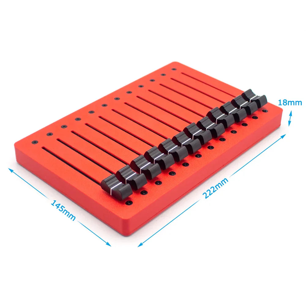 Red rectangular tool holder with black cylindrical inserts for em-12f motor fader midi 12-channel controller faders usb plug