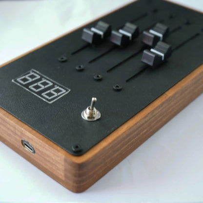 Black digital audio mixer with wooden casing and four knobs em-4 mixer automatically maps volume faders mixing console