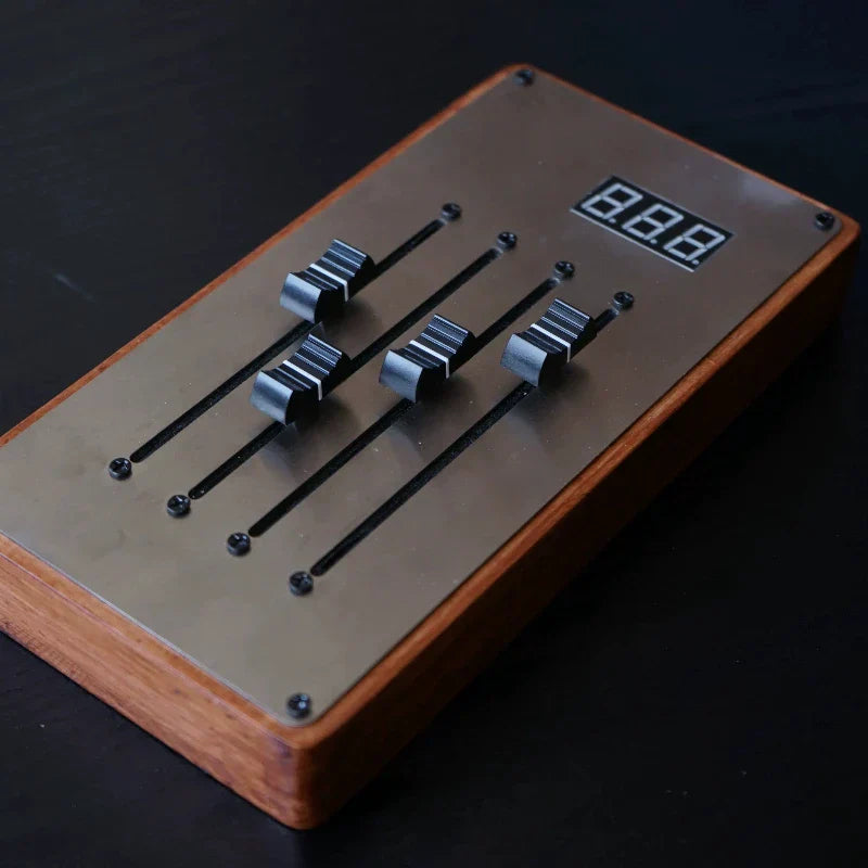 Rectangular wooden midi controller mixer with brushed metal faceplate and four black sliding faders mixing console automatically maps unlimited page turning