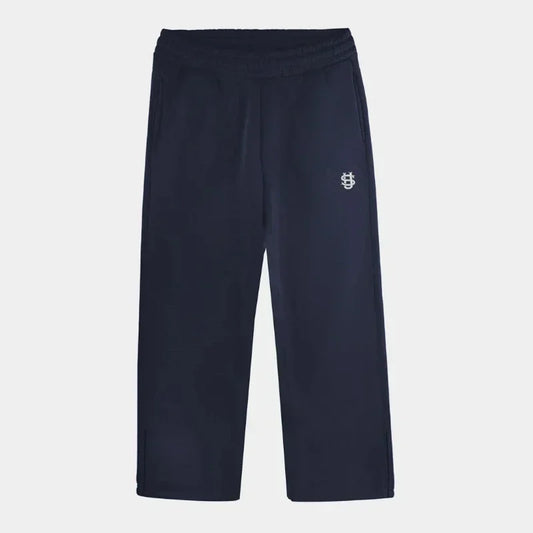 Navy blue cotton embroidered sweatpants with small white logo on upper left thigh from oversized sweatpants casual set y2k clothing