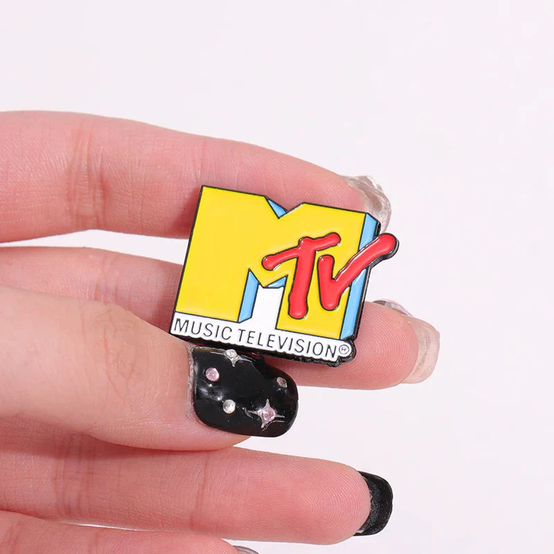A vibrant yellow and red enamel music television pin with glossy finish featuring bold mtv logo for brooches lapel backpack badge fashio jewelry