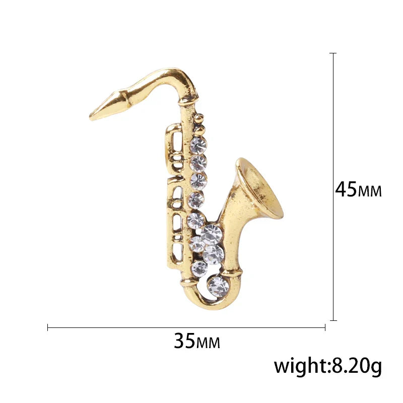 Gold-colored saxophone-shaped pin with clear rhinestones for unisex rhinestone music banquet party backpack gifts