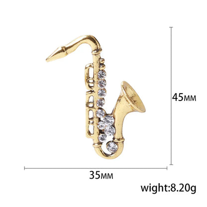 Gold-colored saxophone-shaped pin with clear rhinestones for unisex rhinestone music banquet party backpack gifts
