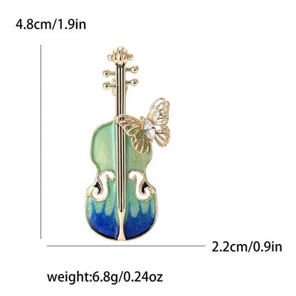 Delicate gold-toned enamel violin brooch with green-blue gradient and butterfly accent for banquet party backpack gifts