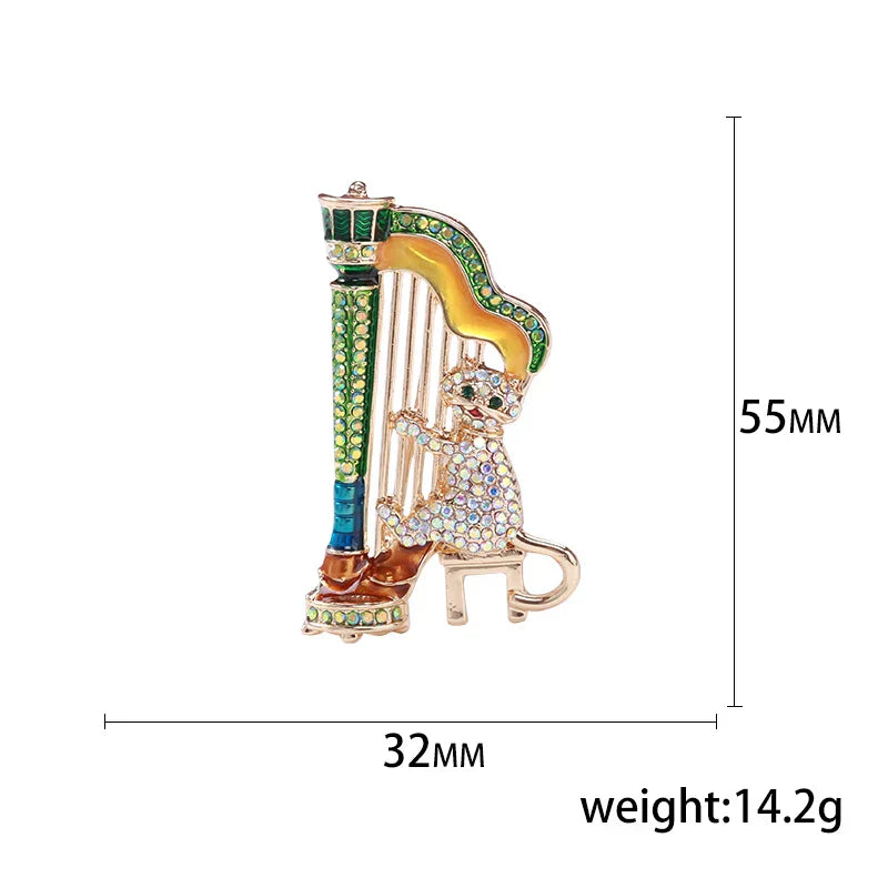 A sparkling gold-toned harp-shaped enamel violin brooch with green blue yellow accents and rhinestones for banquet party backpack gifts
