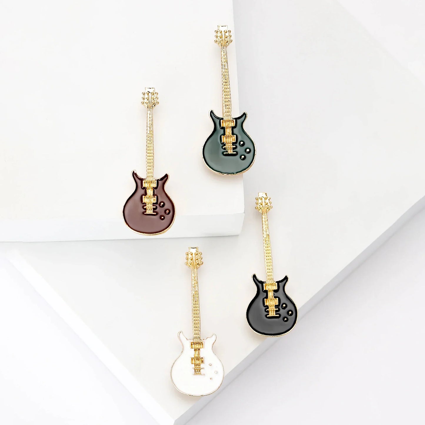 Four miniature guitar-shaped enamel violin brooches with gold hardware in green brown black and white for banquet party backpack gifts