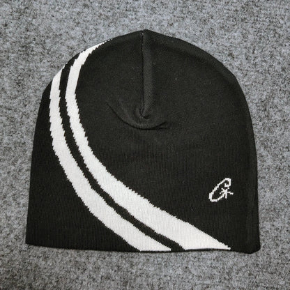 Black knit beanie with two bold white diagonal stripes and small embroidered logo, a trendy hip-hop casual pullover hat