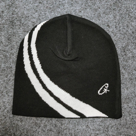 Black knit beanie with two bold white diagonal stripes and small embroidered logo, a trendy hip-hop casual pullover hat