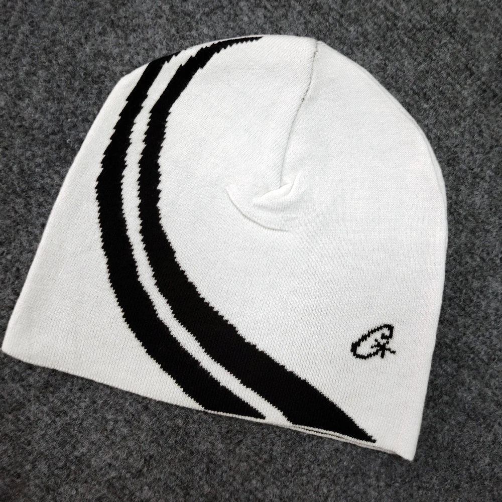White knit beanie with bold black curved stripes and small embroidered logo, european and american trendy hip-hop hat