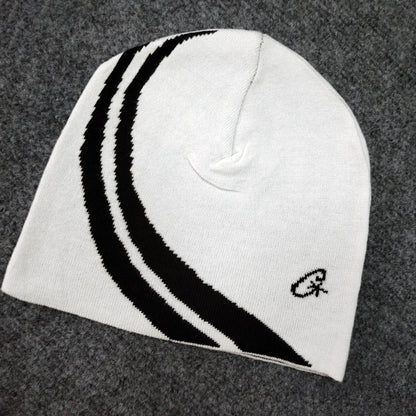 White knit beanie with bold black curved stripes and small embroidered logo, european and american trendy hip-hop hat