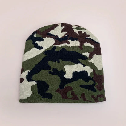 A european camouflage knitted beanie in green brown black and white designed as a warm hip hop outdoor retro beanie