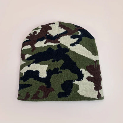 A european camouflage knitted beanie in green brown and black designed as a warm hip hop outdoor retro beanie