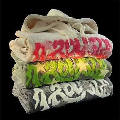 Stacked loose hood shirt harajuku y2k with bold colorful embroidered lettering and star motifs in pink green and white