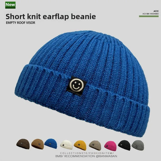 Vibrant blue hip hop beanie knitted hat men skullcap women winter with ribbed texture and black patch smiley face