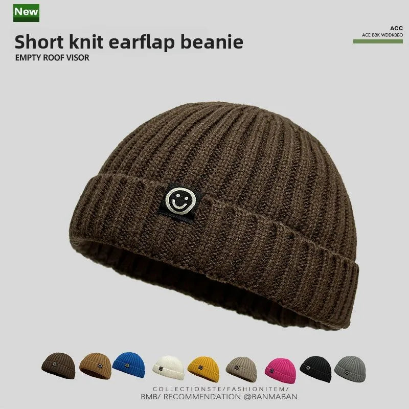 Brown short knit hip hop beanie with ribbed texture and black smiley patch for men skullcap women winter warm brimless wear