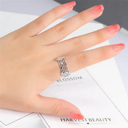 A delicate silver musical note ring with an intricate floral design and stones for female music lovers and wedding party music