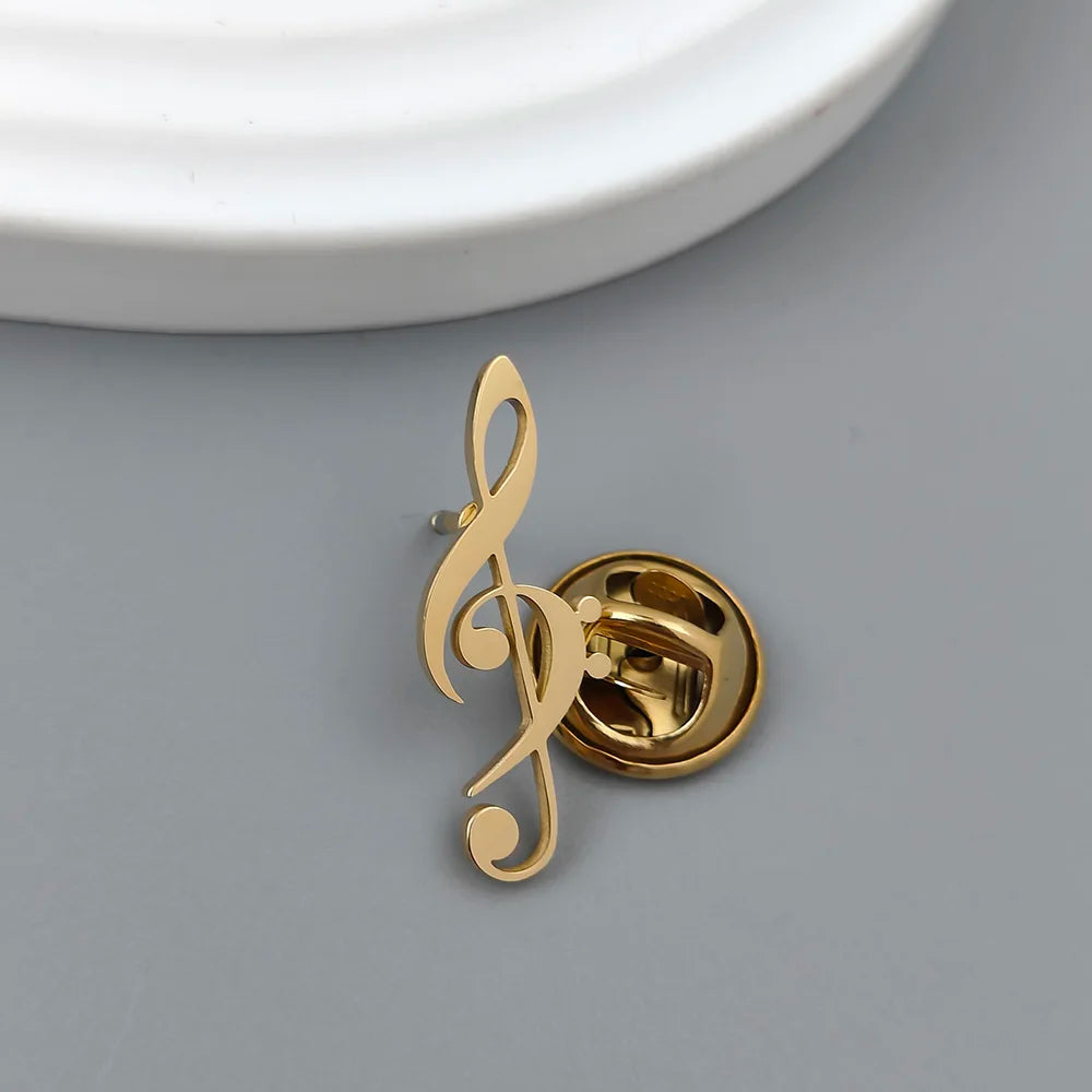 Gold-colored stainless steel music symbol brooch shaped like a treble clef for fashionable music symbol lovers