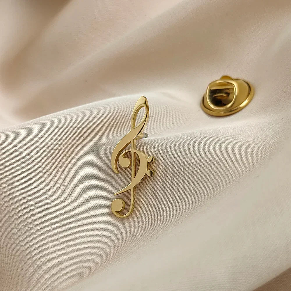 Gold-colored stainless steel music symbol brooch shaped like a treble clef for fashionable music lover accessories