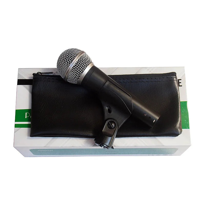 Black handheld cordless sm58s with silver mesh grille and shock mount resting on carrying case for microphone karaoke studio use