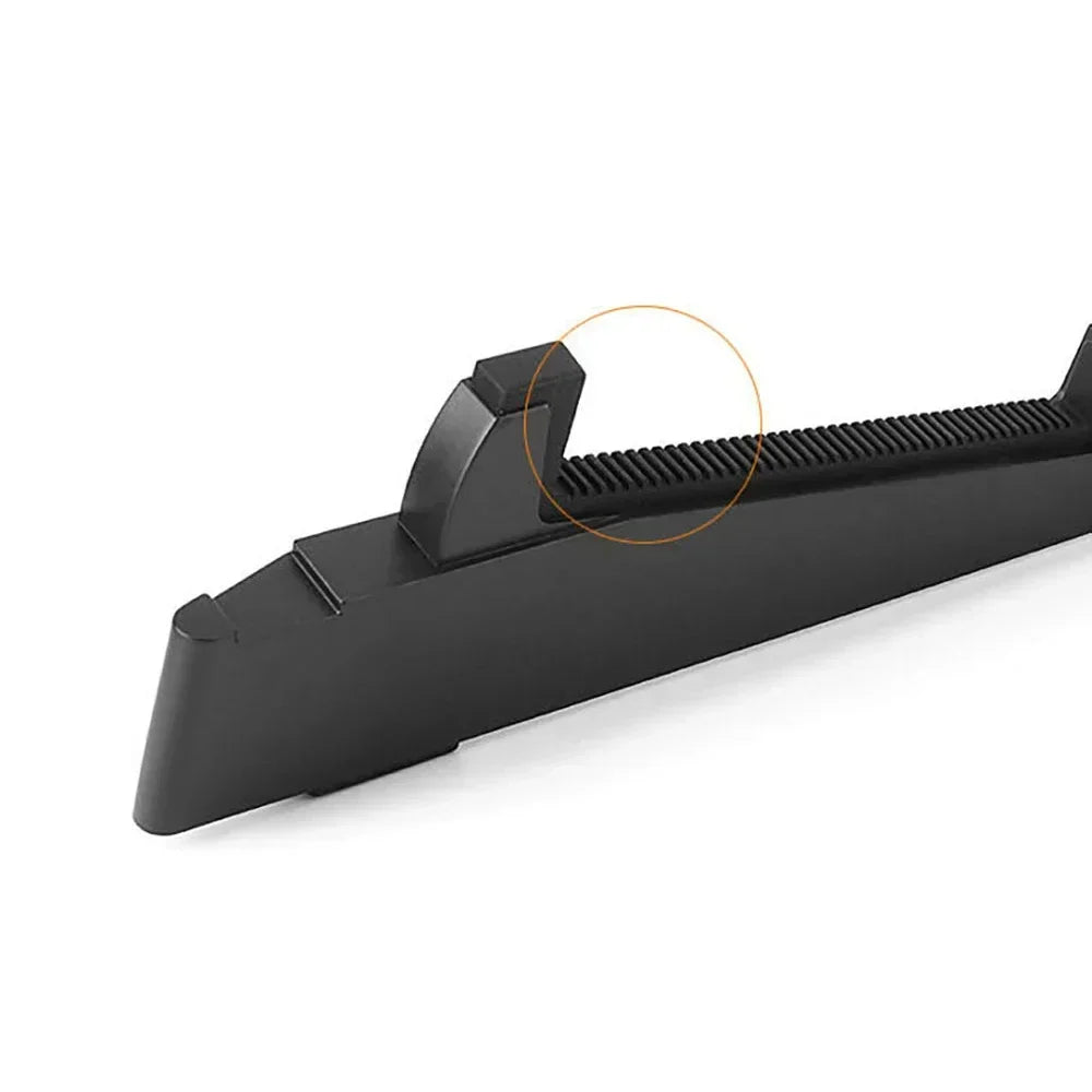 Black plastic windshield wiper blade with textured ribbed edge and molded bracket shown with flanger portable guitar stand