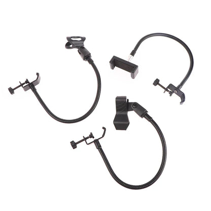 Set of black flexible microphone gooseneck phone and camera holders with adjustable clamps for radio broadcasting studio and live broadcast equipment stations